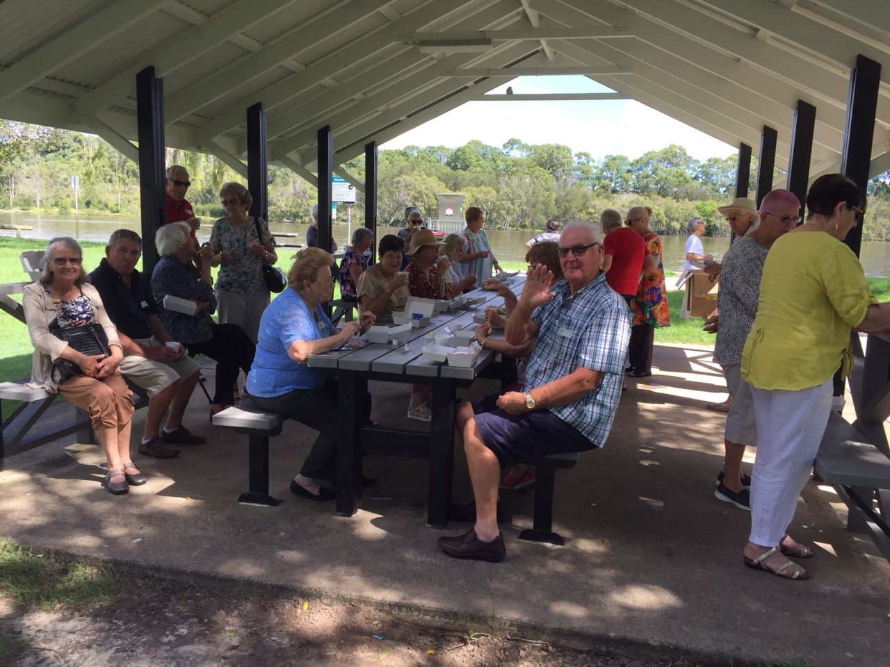 Members and guests enjoying morning tea beside the Coomera River at Hope Island during the March 2021 Mystery bus trip