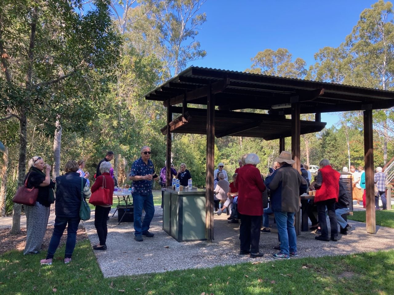 Members enjoying morning tea at the Glass House Mountains Information Centre during July 2023 bus trip