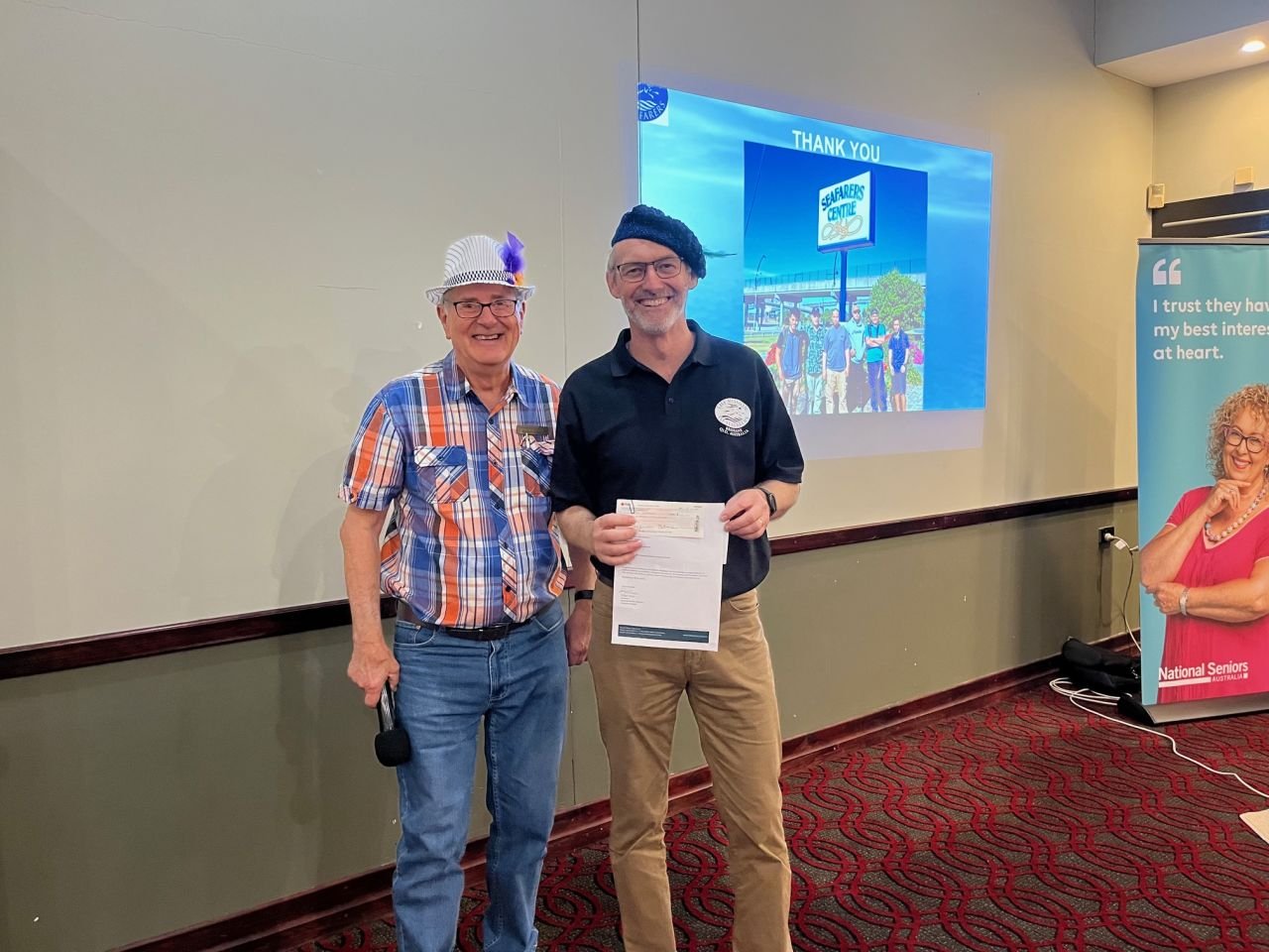 Branch Secretary, Graham Tienan, presents guest speaker, Capt Ross Nicholls of the Mission to Seafarers Brisbane with a donation cheque at November 2023 branch meeting