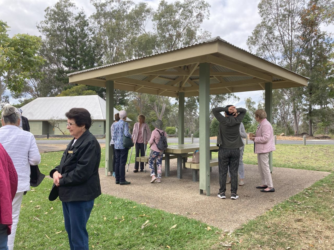 Members and guests enjoy a morning tea break at Cormorant Park at Wivenhoe Dam during  a day bus trip in September 2023