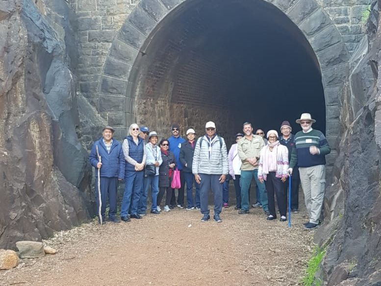 Members standing at the entrance of the Railway tunnel built in the late 19C